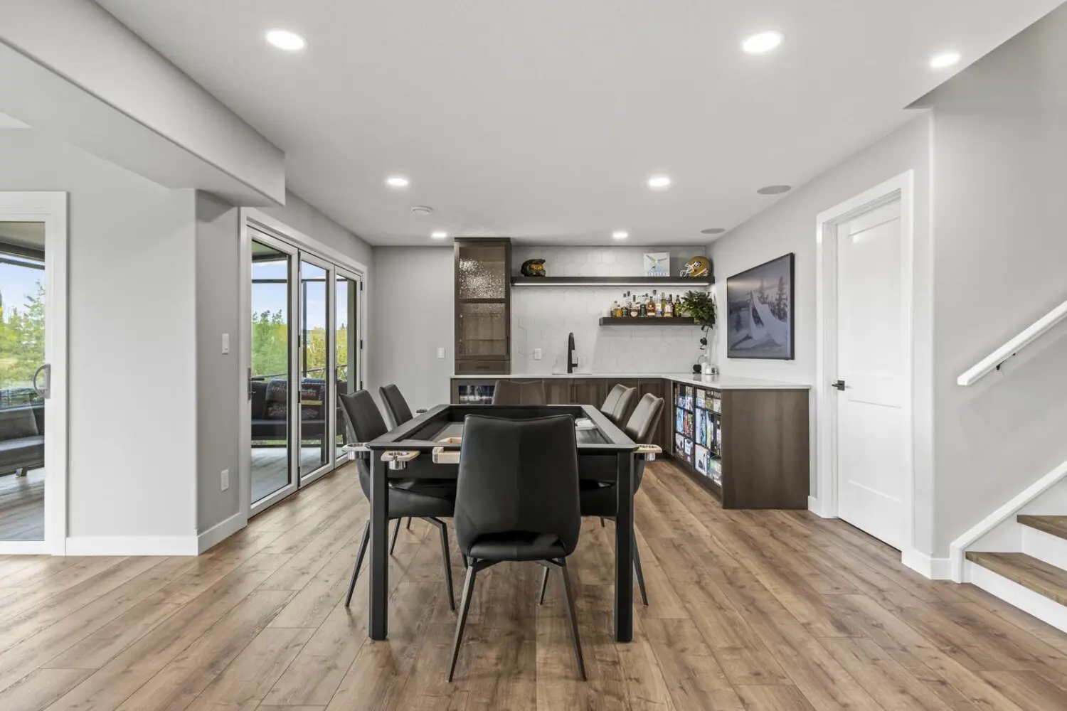 Mode Built team completes luxury walkout basement development in Newbury Court Edmonton with custom bar and sliding glass doors