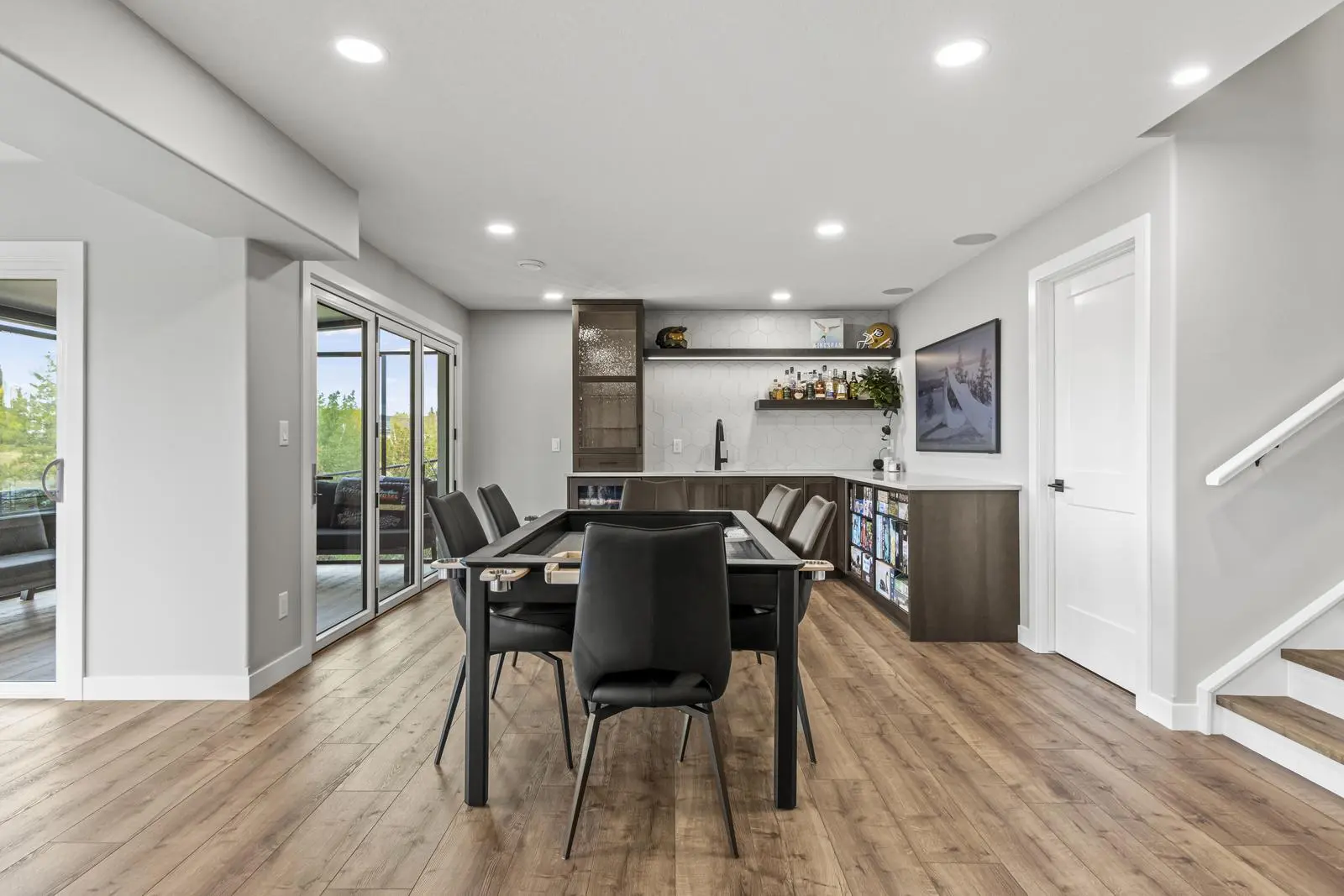 Mode Built team completes luxury walkout basement development in Newbury Court Edmonton with custom bar and sliding glass doors